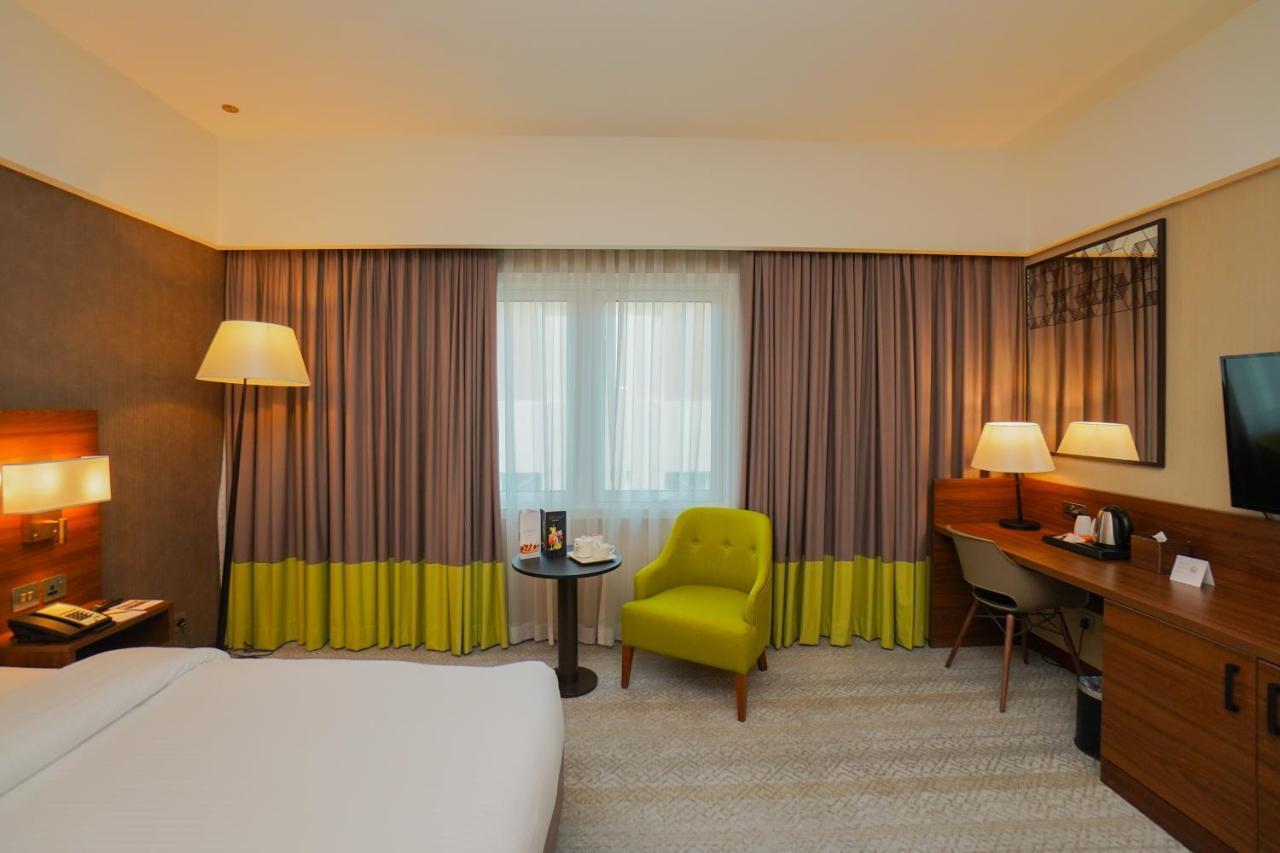 The Grand Lux Hotel Doha Exterior foto A room at the hotel